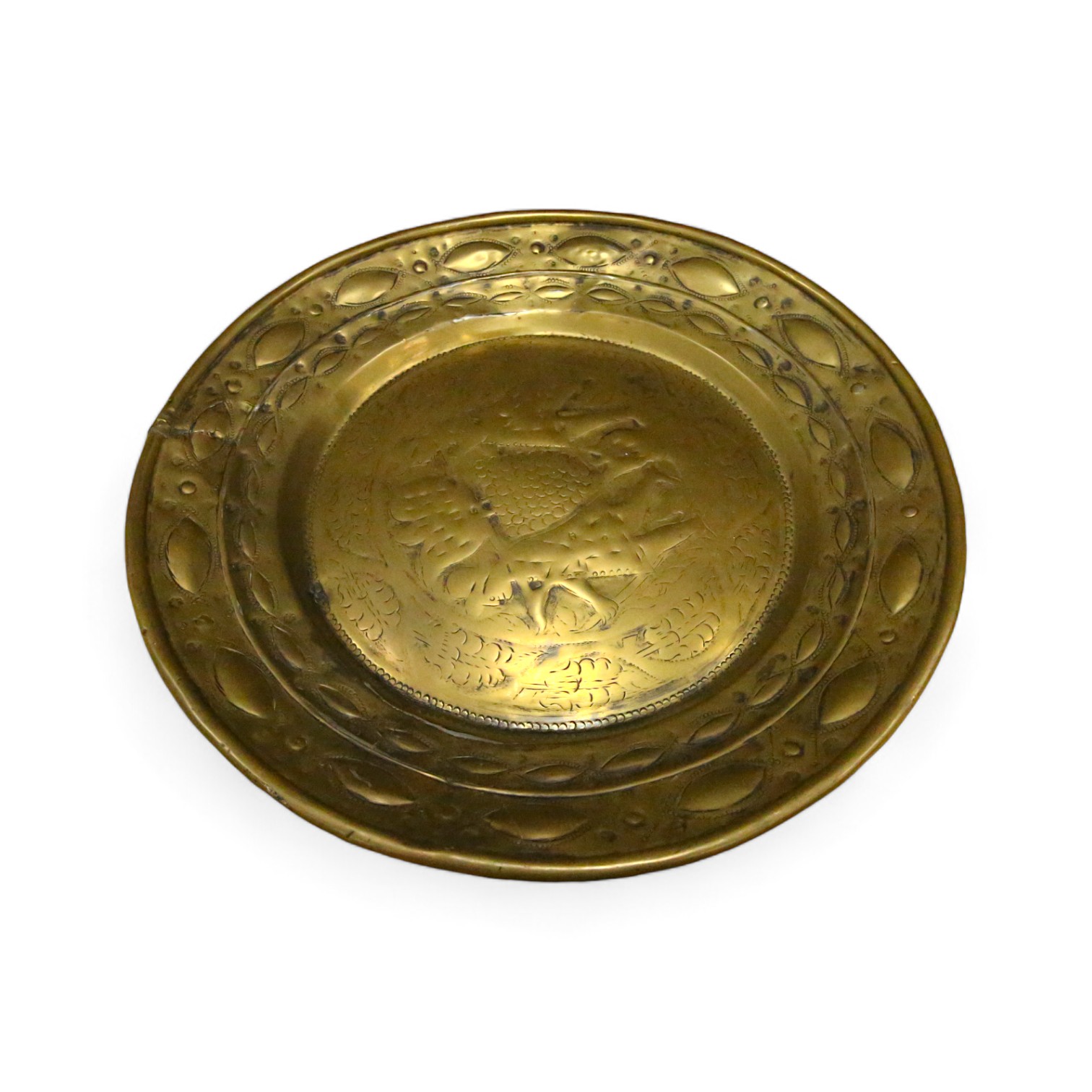 A 17th century Nuremberg brass alms dish, 43cm diameter. Condition - good for age